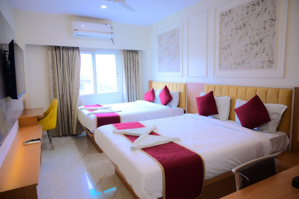 Deluxe Quadruple Room, City View | Desk, laptop workspace, WiFi (free)