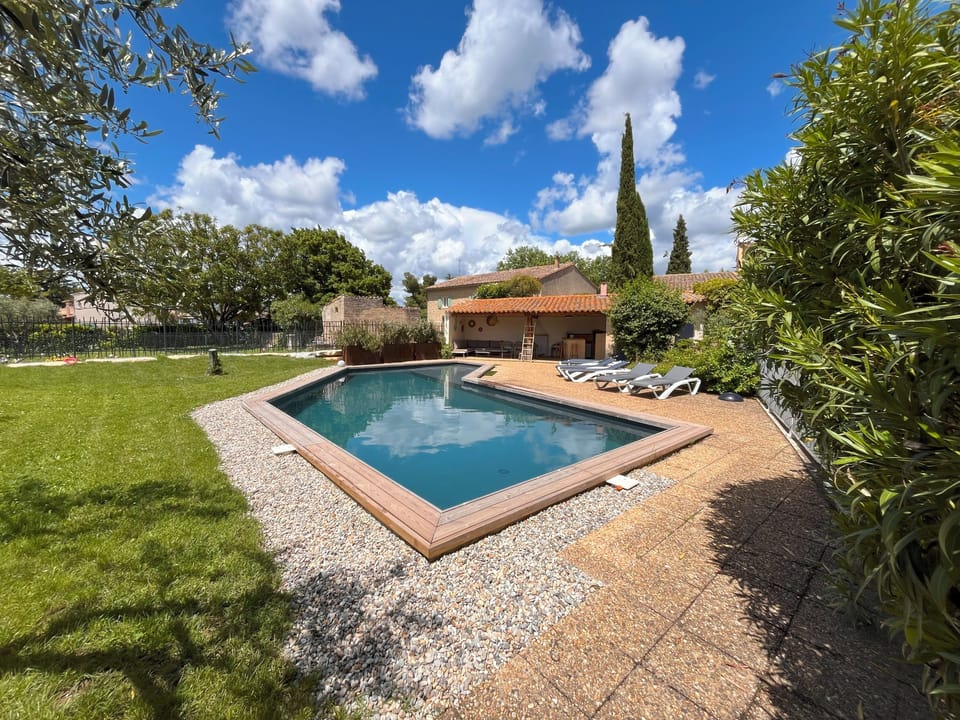 Seasonal outdoor pool, open 9:00 AM to 7:00 PM, pool umbrellas