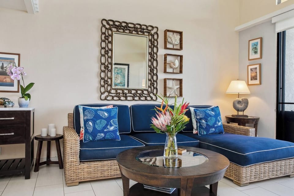 Island chic meets comfort in this airy space with navy cushions, woven textures, and open lofted serenity     NAP-C31