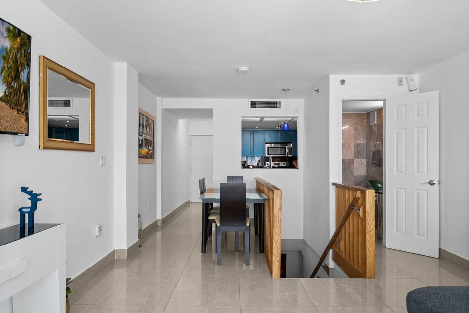Living Room with Ocean Views
Relax in the living room with a 50-inch TV and one of Miami Beach’s most desirable ocean views. Step onto your private balcony, enjoy a fresh coffee, watch the sunrise, and feel the ocean breeze right from your stay.