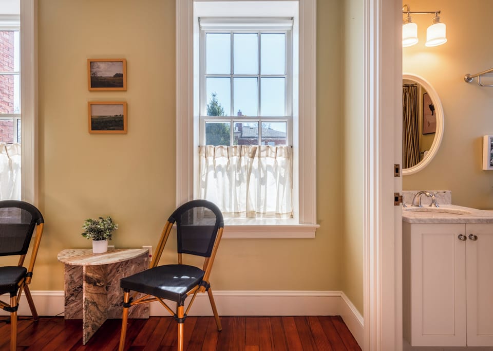 Relax in this sunny second-floor apartment with peaceful views of the Commons.