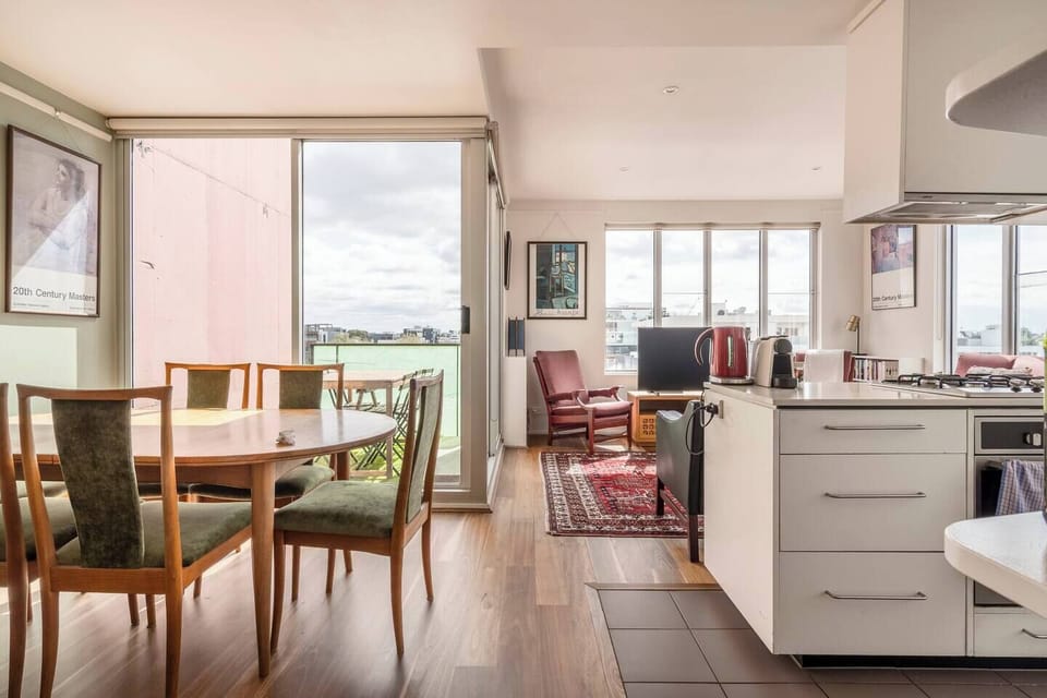 Experience the easy flow of dining, cooking, and lounging in a bright, open-plan design.
