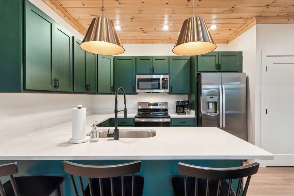 Pull up a stool and keep the cook company—the kitchen is for more than cooking.
