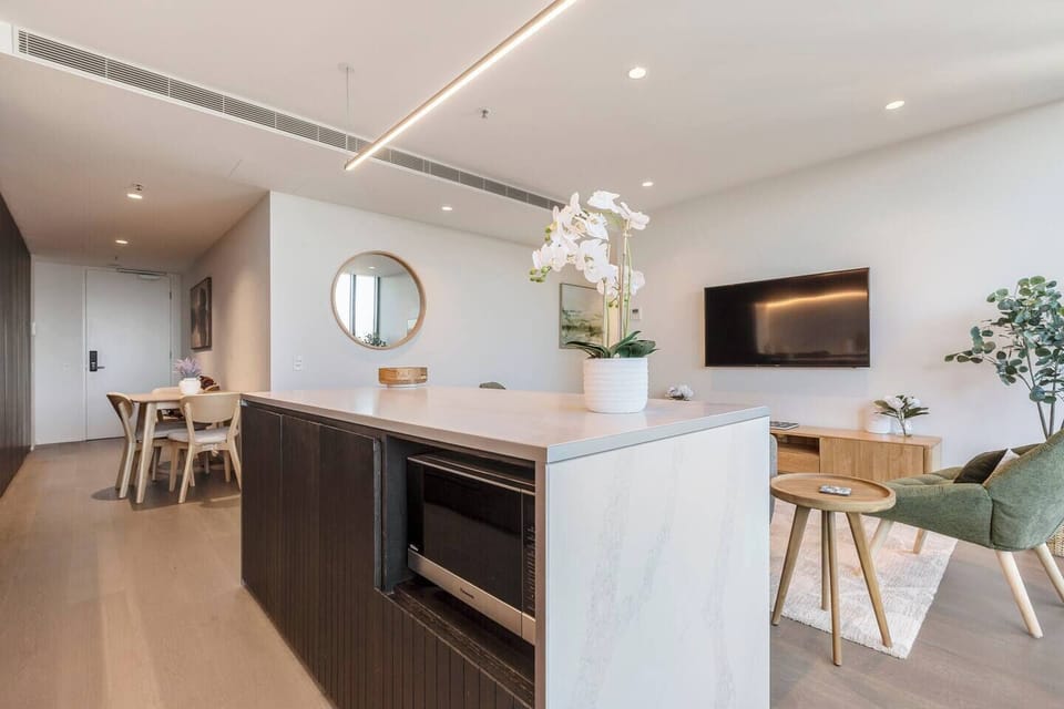 Use the island bench as a dedicated meal prep space, keeping everything within easy reach as you cook.