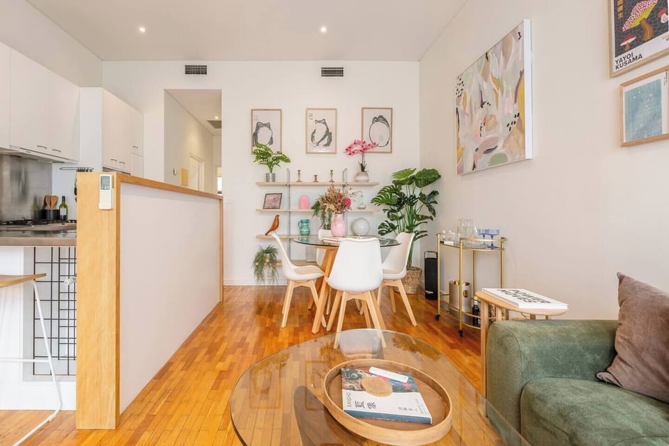 Curated artwork, greenery and layered decorative pieces give the apartment a warm, creative energy that reflects Richmond’s artistic character.