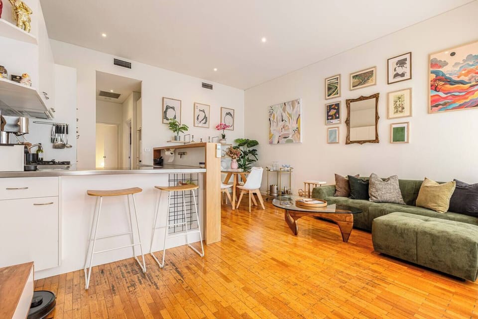 The open-plan layout connects the kitchen, dining and living spaces with an easy flow designed for relaxed mornings, shared meals and comfortable longer stays.