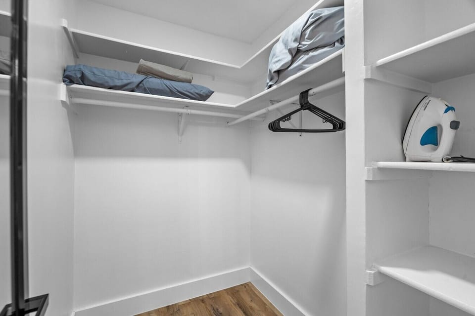 A walk-in closet with extra linens, hangers, and a steamer keeps your travel wardrobe fresh.