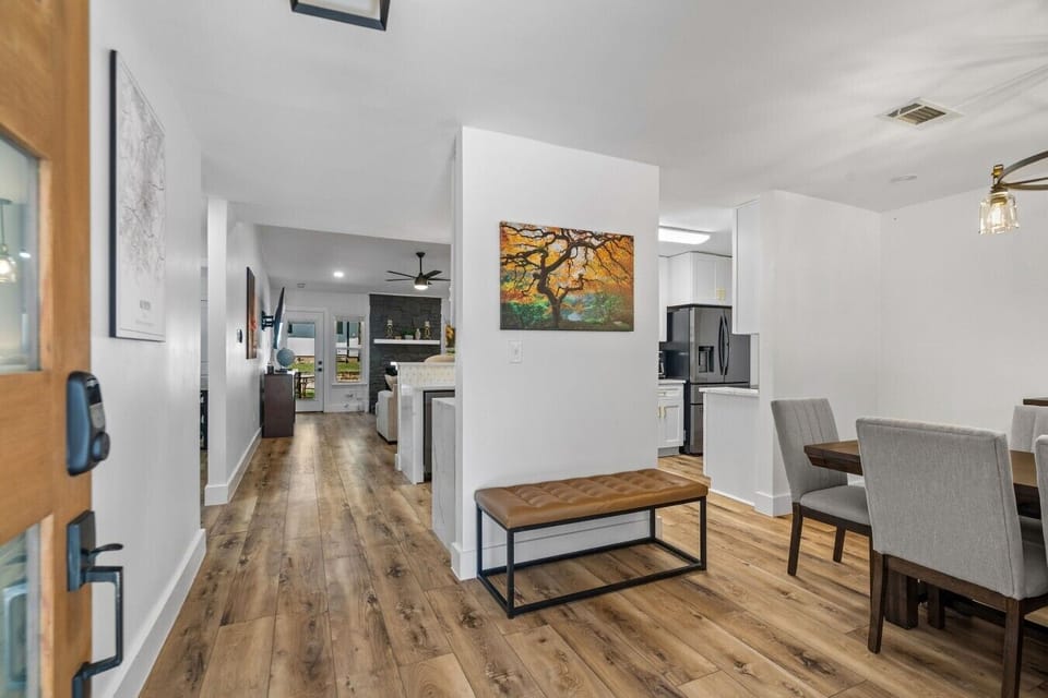 Step inside to an open, light-filled entry that flows straight through to the dining and living areas.
