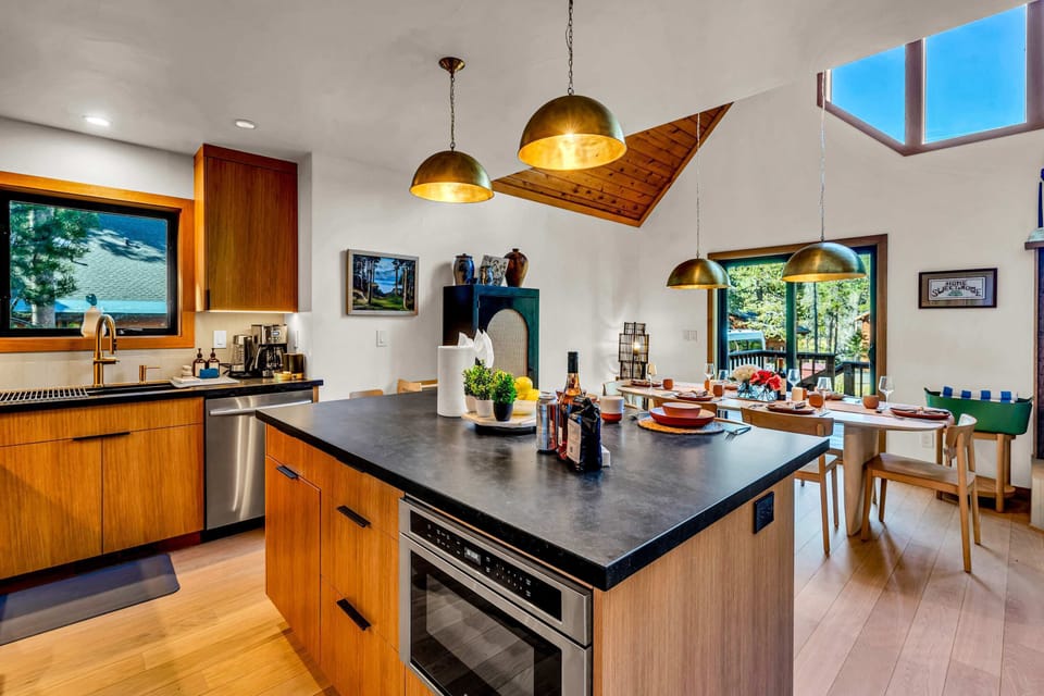 Kitchen: Drip coffee maker, range, microwave, refrigerator with ice maker and filtered water dispenser, dishwasher, garbage disposal, toaster oven, air fryer, food processor, kettle, cooking utensils, tableware
