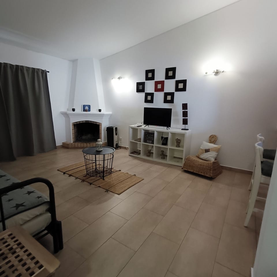 Apartment, 1 Bedroom, Garden View | Living area | 24-inch flat-screen TV with cable channels, TV