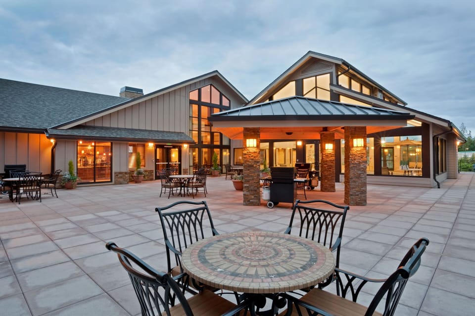 Settle onto the outdoor patio, furnished with tables and lounge seating