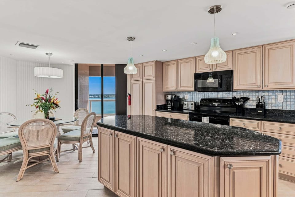 Large, newly updated kitchen and breakfast nook with balcony access.