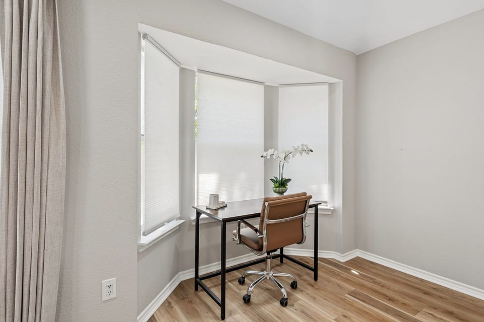 Take advantage of the primary suites privacy and natural light to get some work 