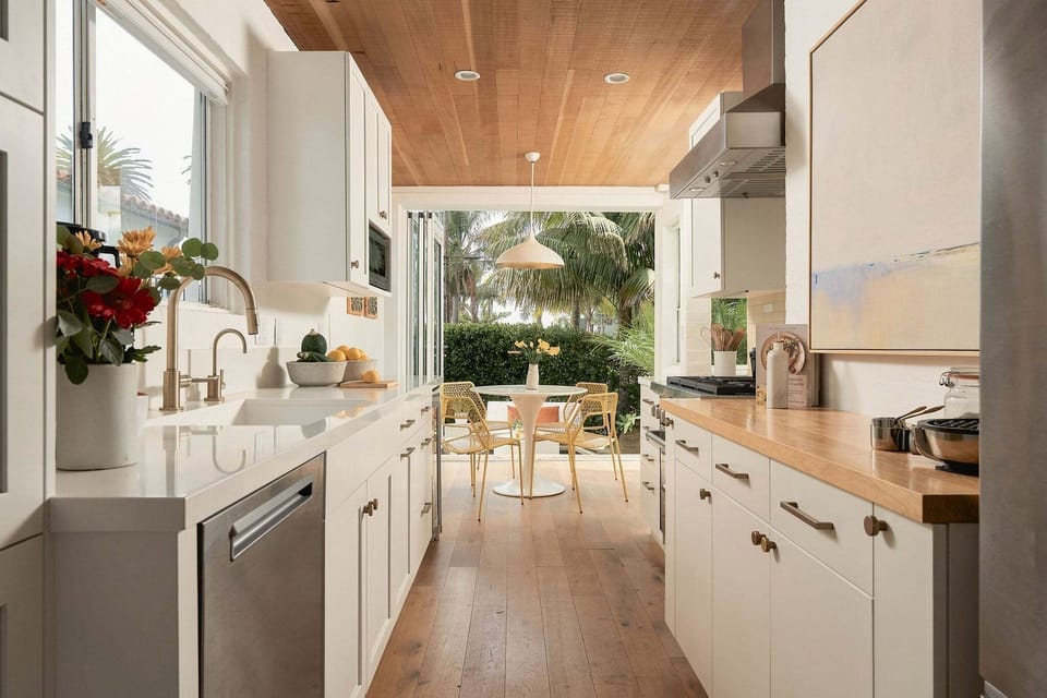 Bright open kitchen leading into breakfast table