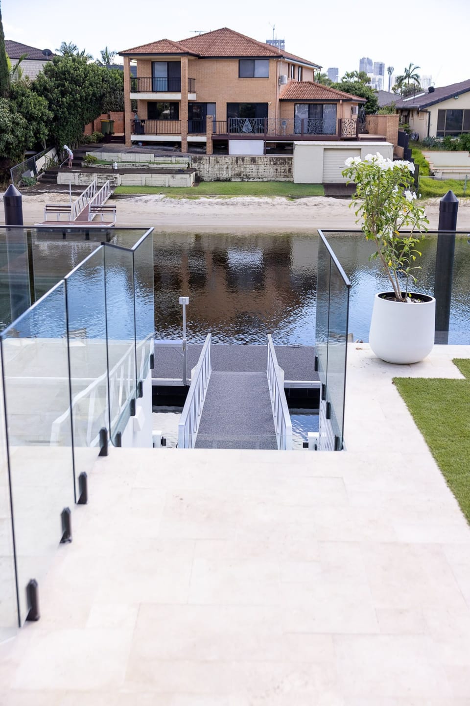 The private pontoon, reached by a gangway off the back lawn