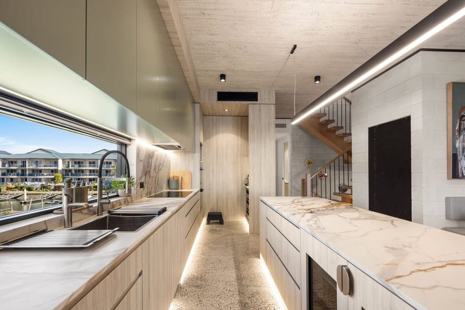 The same run looking back, induction cooking and the stair to the lower level