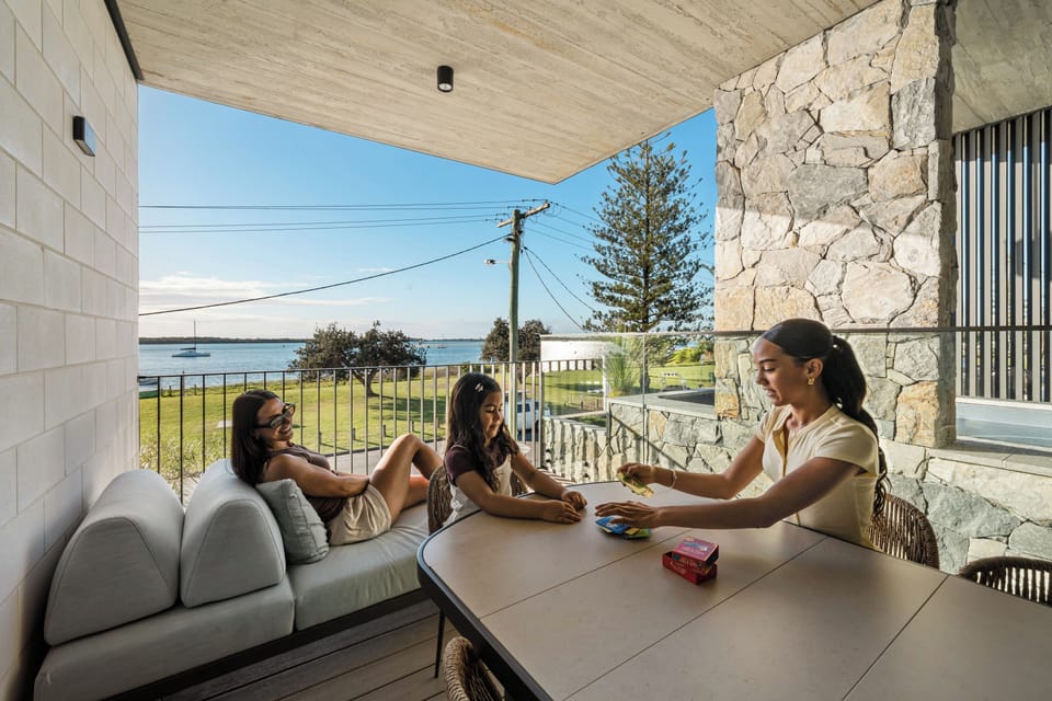 The spa set between a stone wall and timber screens
