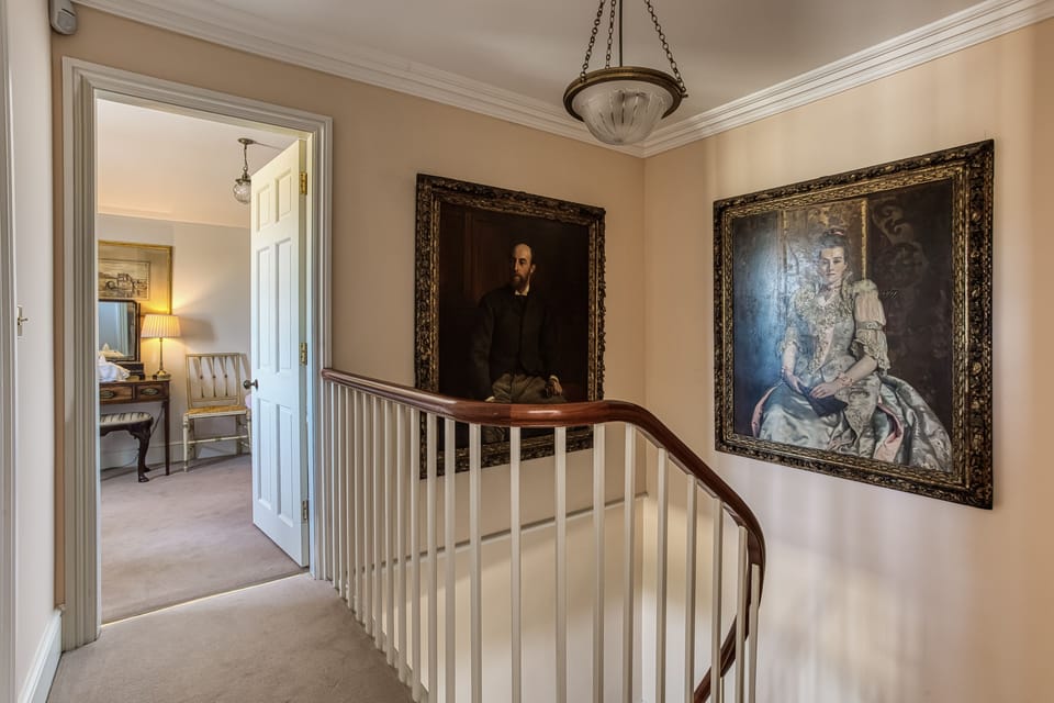 A comfortable ground floor bedroom overlooking the gardens