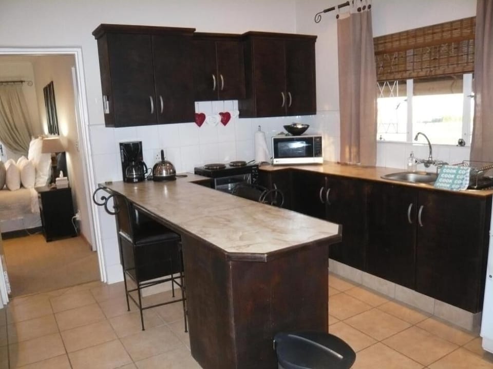 Fridge, microwave, coffee/tea maker, cookware/dishes/utensils