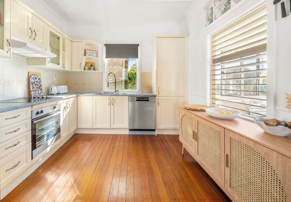 Well equipped kitchen featuring electric cooking appliances and a dishwasher