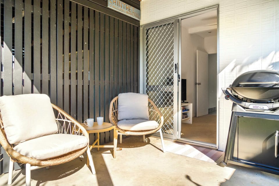 Two patio chairs create a simple spot to enjoy the beautiful Passage views