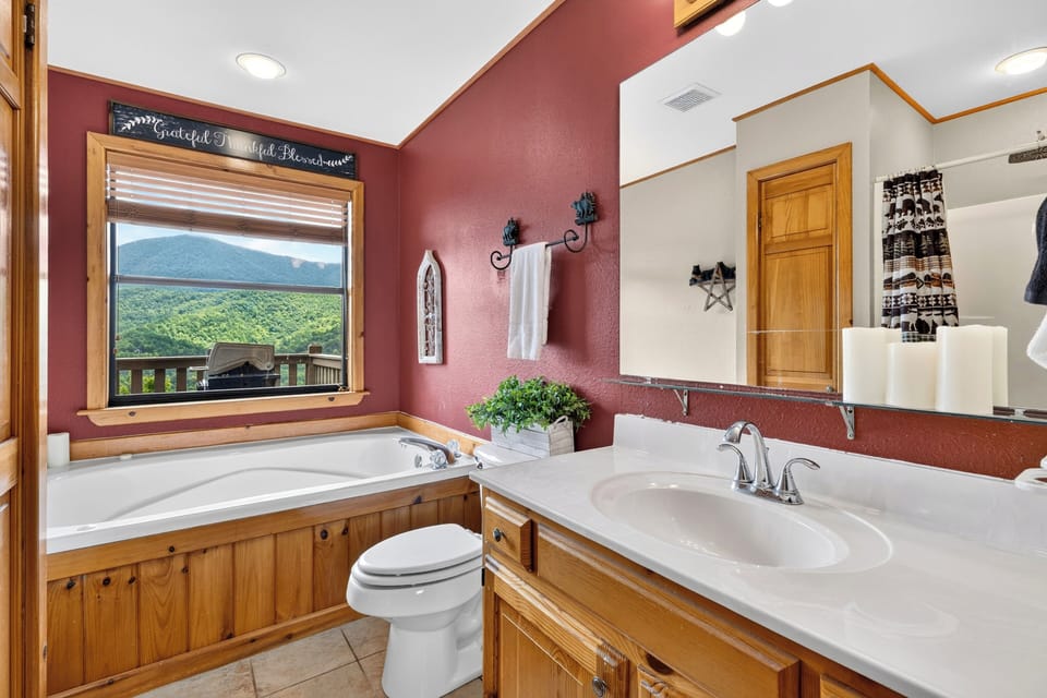 Ensuite bath with a jetted tub and vanity