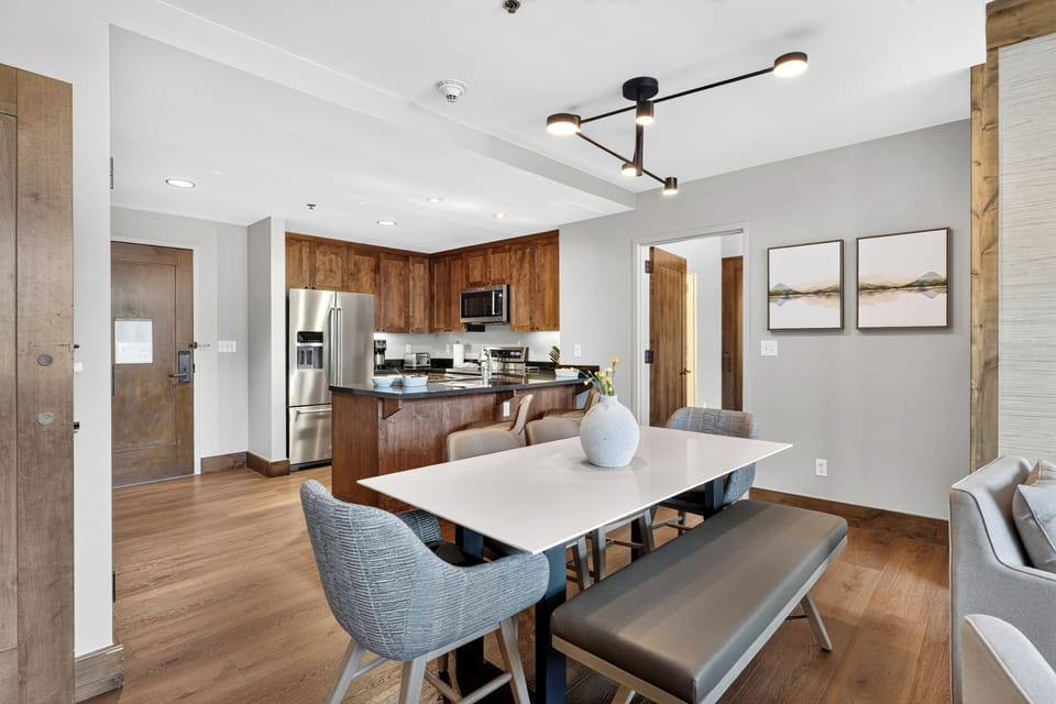 Gather for meals with sweeping mountain views just beyond the open-concept dining and living space.
