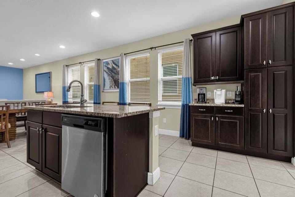 Large kitchen island with dishwasher and generous counter space