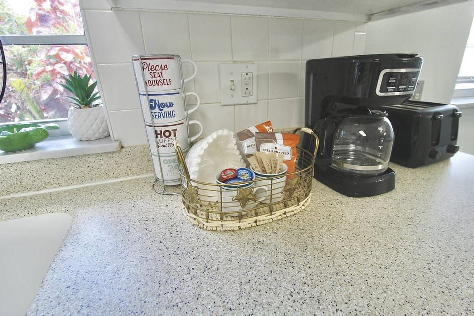 Enjoy the coffee bar area with a stocked coffee basket.