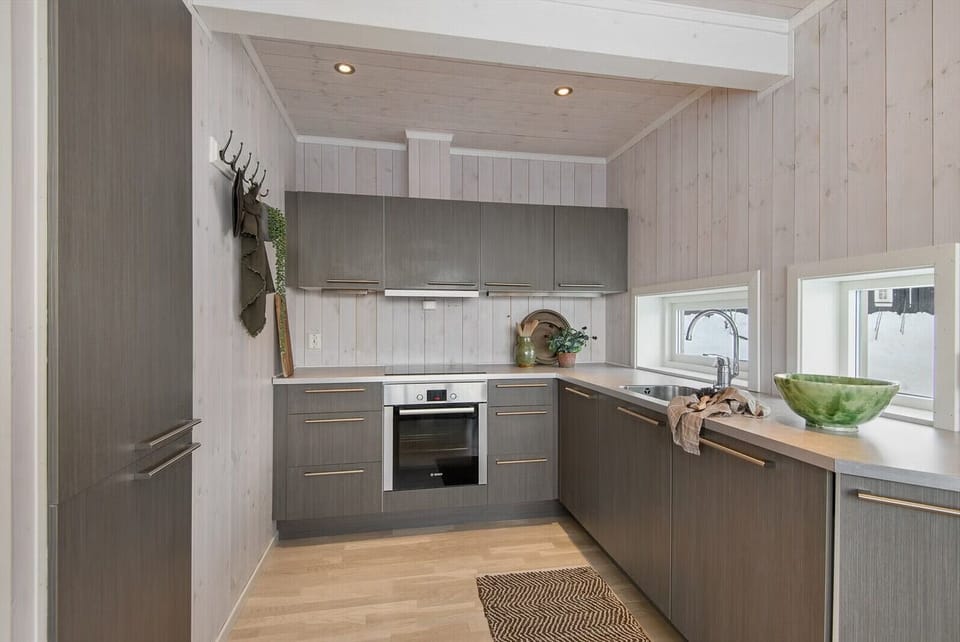 Fully equipped kitchen with cooking essentials and comfortable dining space with seating for the whole family.