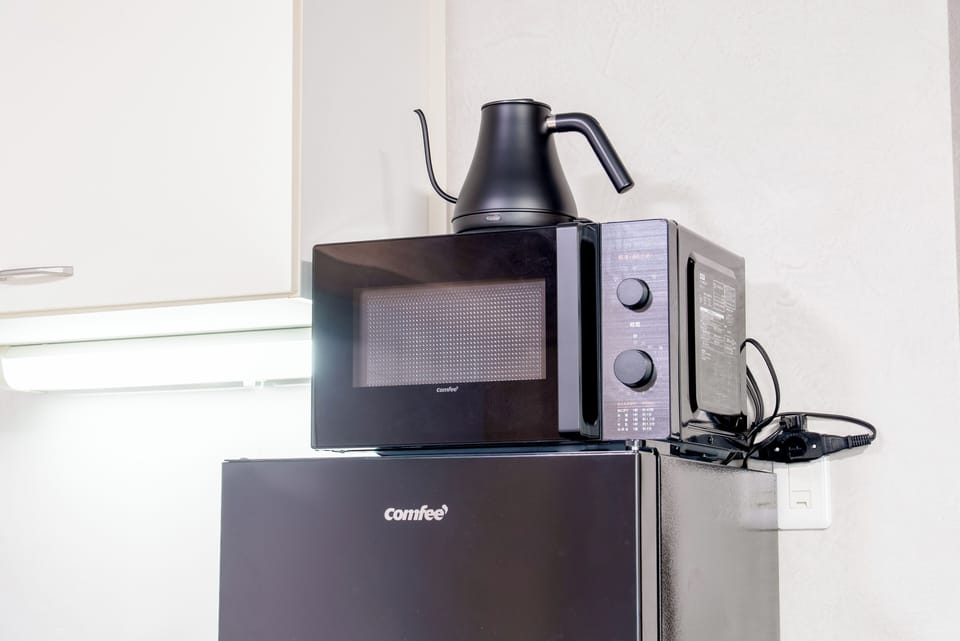 Deluxe Quadruple Room, Balcony | Microwave