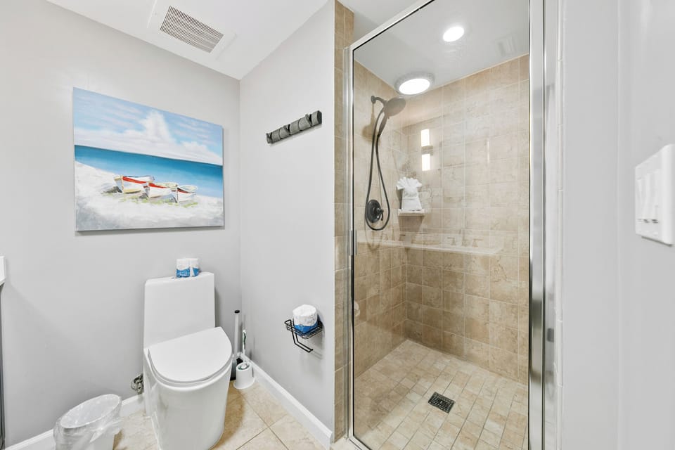 The full bathroom with walk-in shower off the bunk room