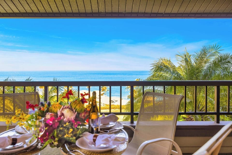 Outdoor meals feel extra special on your shaded balcony with elevated ocean and garden views. KRV-2421