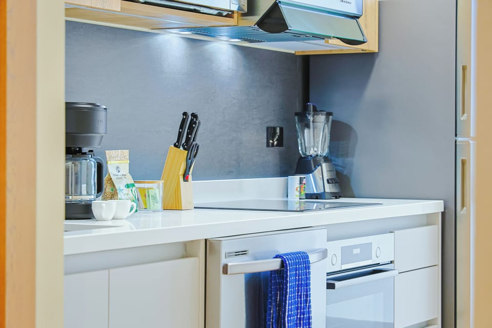 Your thoughtfully equipped kitchen has everything you need to whip up a quick meal or brew fresh coffee in the morning, with modern appliances and bright under-cabinet lighting to set the tone.