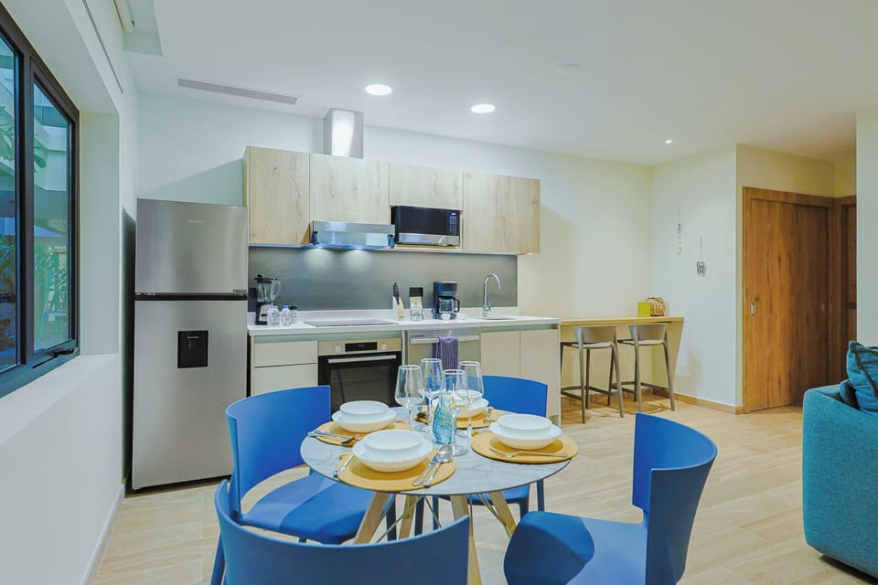 Prepare your favorite meals in this bright, modern kitchen with stainless appliances and ample counter space. The open layout flows seamlessly to your dining area, perfect for gathering over home-cooked meals.
