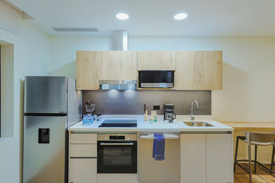 Your fully-equipped kitchen is ready for any meal you want to prepare, featuring modern appliances, sleek countertops, and thoughtful touches like a coffee maker for leisurely mornings.