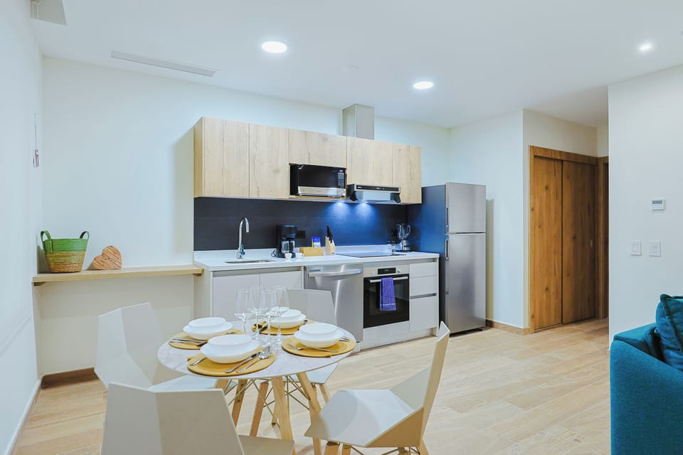 Your fully equipped kitchen is ready for you, with modern appliances, sleek countertops, and a cozy dining nook where you can savor meals together.
