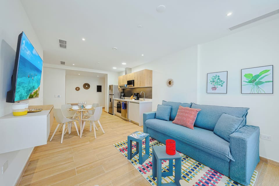 Step into your bright, modern retreat where coastal-inspired decor meets sleek design. Sink into the plush sofa, whip up a meal in your fully-equipped kitchen, and gather at the inviting dining table.