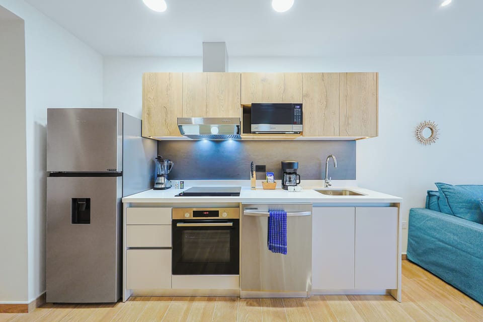 Your modern kitchen is fully equipped for easy meal prep, featuring stainless appliances, sleek cabinetry, and everything you need to cook and unwind.