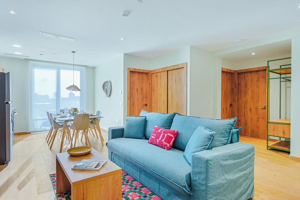 Unwind in this bright, open living space featuring a cozy sofa, warm wood accents, and breezy décor. It's the perfect place to relax, recharge, and enjoy quality time together after a day of island adventures.