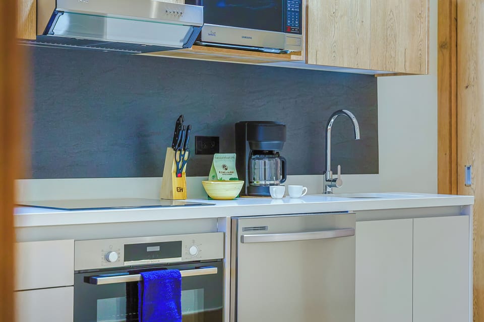 Your fully equipped kitchen includes modern appliances and thoughtful touches—everything you need to prepare your favorite meals or enjoy a leisurely morning coffee in comfort.