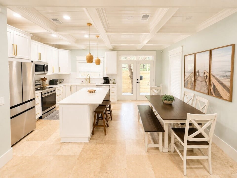 Gather around the farmhouse dining table, open to the chef`s kitchen — the perfect spot for family meals.