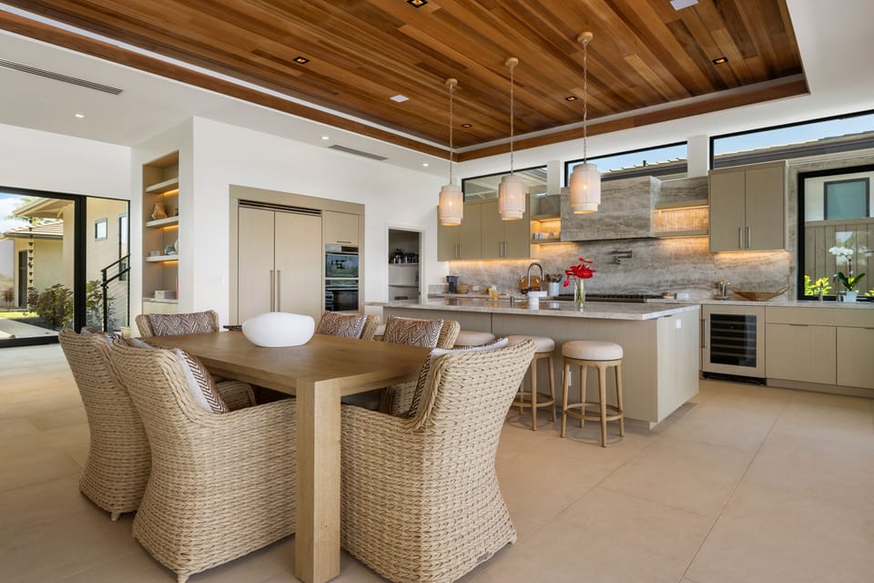 The open-concept kitchen and dining area offers a seamless welcome from the entry.