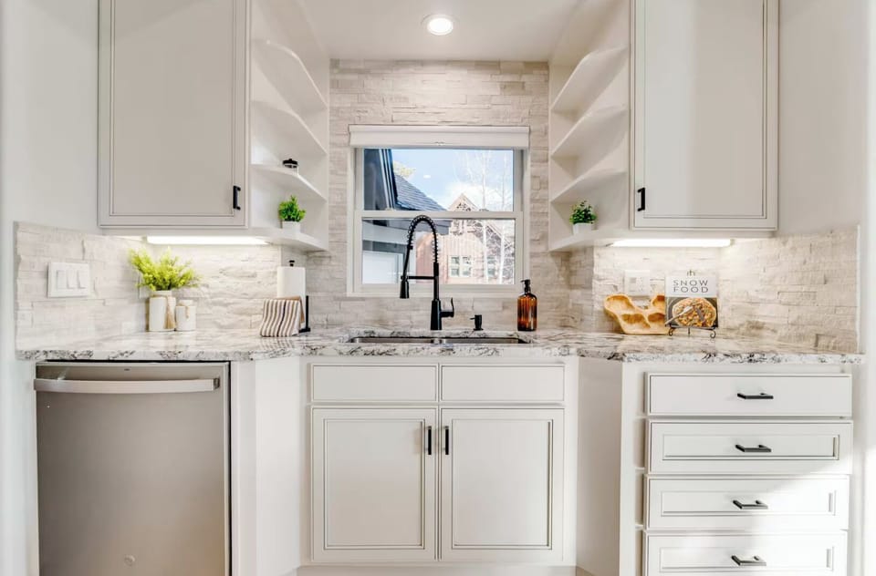 Crisp Modern Kitchen - Designer cabinetry, premium appliances, modern fixtures, and thoughtful lighting create a polished kitchen designed for both beauty and function.