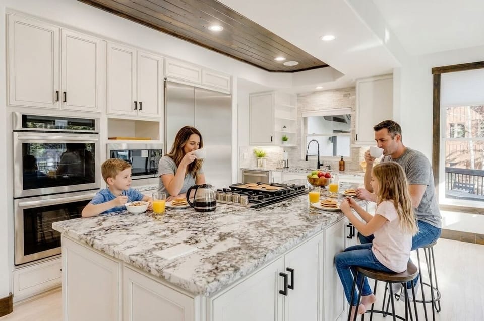 Family Meals Together - The open kitchen and dining area create an inviting setting for shared meals, conversation, and memorable evenings with family and friends.