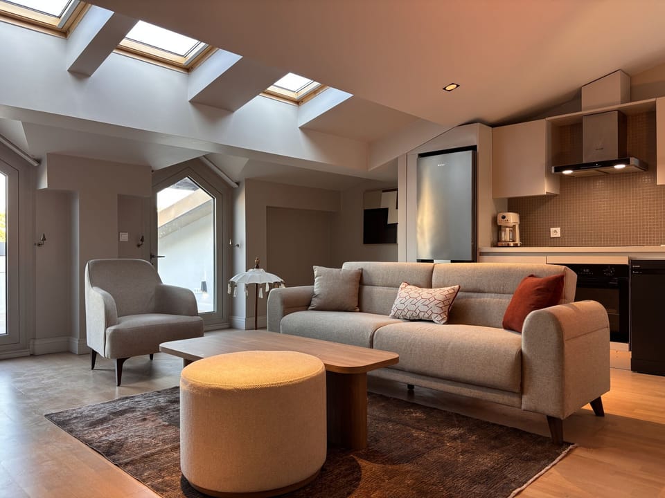 Comfortable lounge beneath a row of skylights