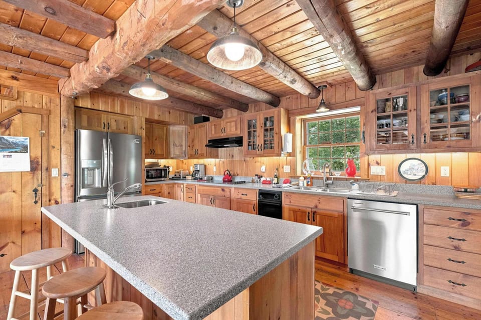 Full-size appliances make longer stays easy, with plenty of counter space and seating at the island.