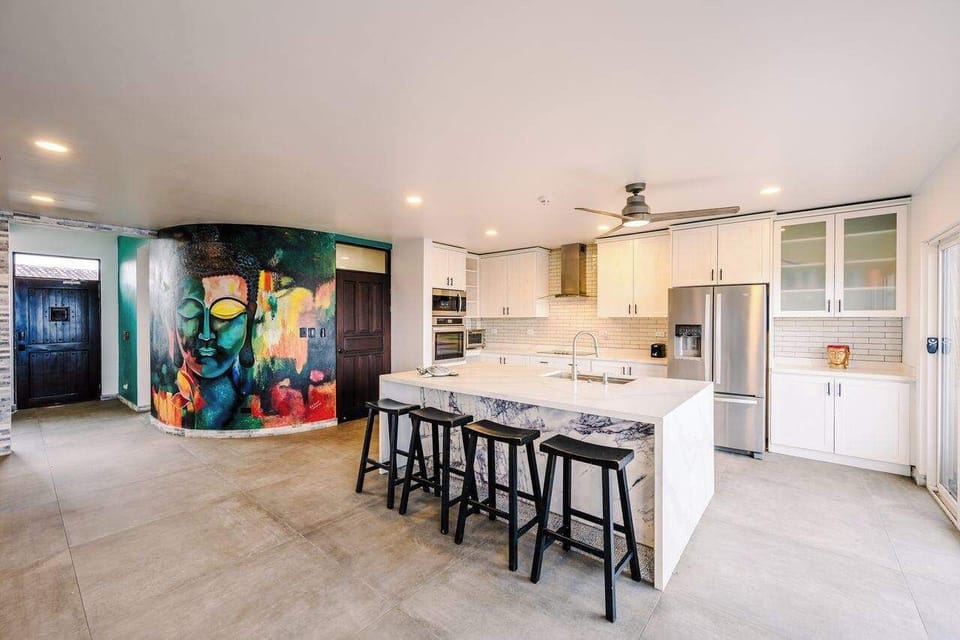 Colorful artwork adds a lively touch to the kitchen area