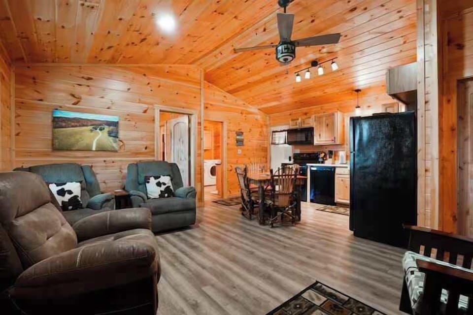 Living Room Retreat: Enjoy gathering around the rustic dining table or relaxing in plush seating!