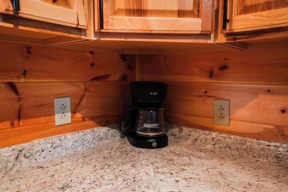 Kitchen: Enjoy morning brews with a charming coffee station in a stylish, wood-trimmed setting!